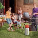 Photo of an outdoor picnic, gas grill powered by a composite cylinder
